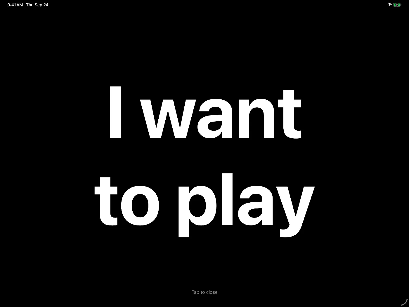 The message 'I want to play' shown full screen in large white letters on black